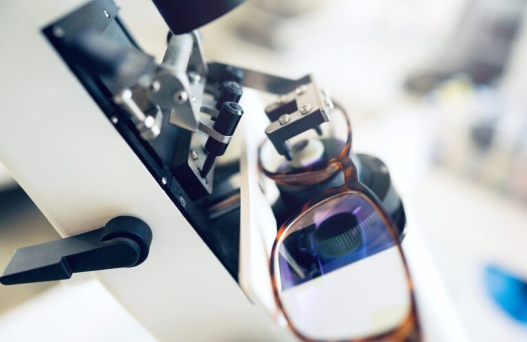 Lens, glasses or tool for eye care, vision and focus with closeup at optometrist or optometry. Eyes assessment, ophthalmology and healthcare for medical support, eyewear or spectacles to see or zoom.